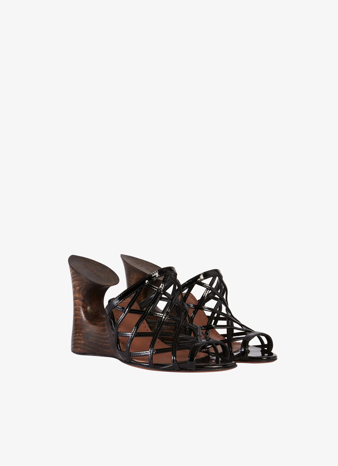 LA SCULPTURE MULES IN PATENT CALFSKIN & WOOD ALAÏA BLACK LA SCULPTURE MULES IN PATENT CALFSKIN & WOOD